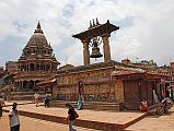 Kathmandu Patan Durbar Square 03 Krishna Temple and Taleju Bell The Krishna Temple (1723) is the octagonal white stone temple as you enter Patans Durbar Square from the south. The large bell hanging between two pillars on the right is Taleju Bell (1736).